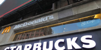 Signage for McDonald's and Starbucks in an urban setting