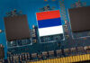 Close-up of a circuit board with a memory chip and a flag design