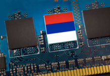 Close-up of a circuit board with a memory chip and a flag design