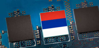 Close-up of a circuit board with a memory chip and a flag design