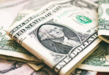 Delivery Driver’s Detour STUNS Americans — $76K! U.S. dollar bills with George Washington visible.