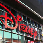 FCC Move Targets Disney Over DEI Concerns Disney sign on building with Mickey Mouse figure