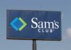 Sign for Sam's Club featuring a blue background and logo