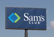 Sign for Sam's Club featuring a blue background and logo