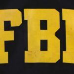 FBI logo displayed in large yellow letters on a black background