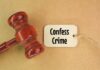 A wooden gavel next to a tag that reads 'Confess Crime'