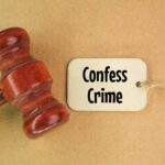 A wooden gavel next to a tag that reads 'Confess Crime'