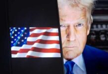 Close-up of a political figure with an American flag in the background