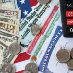 Various denominations of U.S. currency and financial documents on a flag background