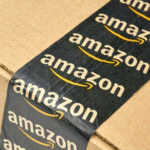 Close-up of an Amazon-branded shipping box tape on a cardboard box