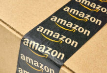 Close-up of an Amazon-branded shipping box tape on a cardboard box