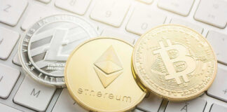 Litecoin, Ethereum, and Bitcoin coins on a keyboard.
