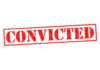 Red stamped text convicted on white background