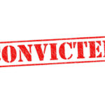 Red stamped text convicted on white background
