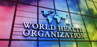 World Health Organization logo on a colorful glass building