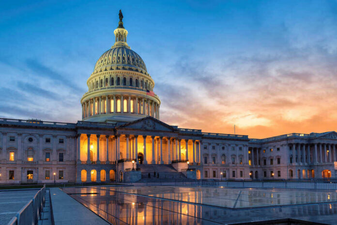 shutterstock_1724685376 U.S. Capitol building at sunset with reflection, Washington D.C.