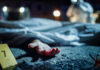 HORROR Discovery: Dead Bodies in Scorching Boxcar Crime scene with covered body and hand exposed.