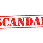 Red stamp with the word scandal