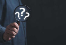 Shocking Fatalities in California — Truth Still Unknown Hand holding magnifying glass with question marks.