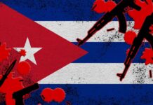 Artistic representation of the Cuban flag with guns and red splashes