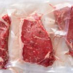 Cookout Shock: $25 Price Gap Stuns Families Three vacuum sealed steaks on a white surface