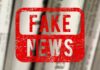 Red stamp with the words 'FAKE NEWS' over blurred newspaper background