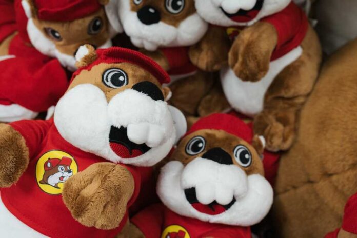 A collection of plush toys resembling a cartoon character, wearing red outfits