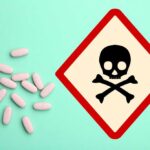 Baby Food POISONED — Rat Toxin Found Inside A bottle of pills spilled next to a poison warning sign