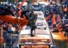 STUNNING Loss: EV Strategy Crumbles Robotic arms welding car bodies in an automotive factory.