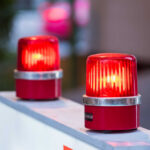 red warning beacons on a barrier