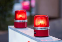 red warning beacons on a barrier