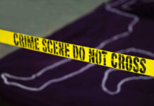 Life Term After Murderous ‘Home Invasion’ Twist Yellow crime scene tape marking off an area with a chalk outline