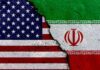 Secret U.S. Military Mission Stuns Iran A cracked surface displaying the flags of the USA and Iran