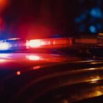 255-Pound Child Death Sparks Murder Case Close-up of a police car's emergency lights at night