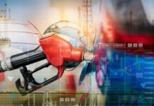 Oil Crashes, Pump Prices Don’t — Why? Gas pump with financial data overlay and oil refinery in the background