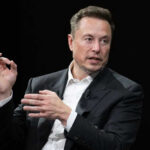 Trillionaire? Musk’s Wild New Number Elon Musk in a suit talking.