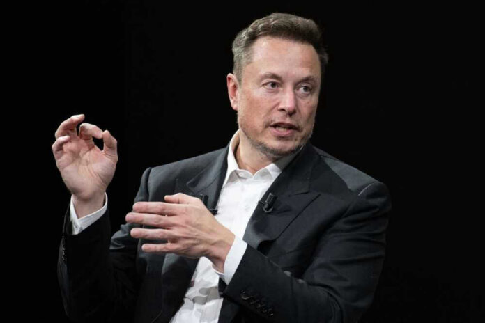 shutterstock_2318800321 Elon Musk in a suit talking.