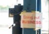 Retail Giant Sinks? 59 Stores Vanish Sign stating 'Going out of Business' attached to a pole