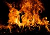 Bright flames dancing against a dark background