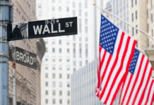 Wall Street Lawyer Tapped To Run Spies?! Street signs for Wall Street and Broad Street with American flags