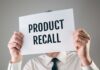 Vehicle Fire Alert – Park It Outside – 1 Million at Risk Person holding a sign reading product recall