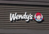 Wendy’s Rolls Dice On New Flavor Wendy's restaurant sign featuring the brand logo