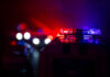 Downtown Massacre — No Arrests Police car lights shining in the dark.