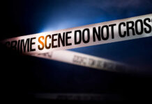 VIDEO: Summer Fun Turns Kill Zone Police tape reading 'CRIME SCENE DO NOT CROSS' in a dark setting