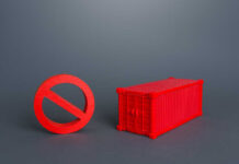 Trade Weapon Unleashed: USMCA Put On Probation A red prohibition sign next to a red shipping container