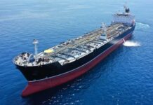 Tanker Blasts Trigger Oil Money Freeze A large oil tanker sailing on calm ocean waters