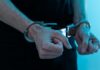 Close-up of hands in handcuffs