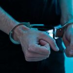 Deli Stock Mania Ends In Handcuffs Close-up of hands in handcuffs