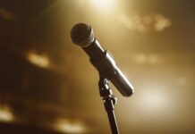 Hospital Fight Ends: Music Superstar Gone Close-up of a microphone on a stage with soft lighting