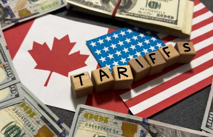 Tariffs,Between,The,United,States,And,Canada.,Usa,And,Canadian A view of stacked shipping containers at a port with a bridge in the background